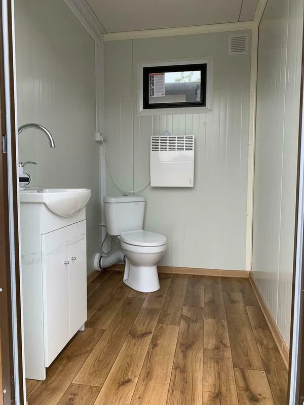 Dubbele sanitaire container met afvalwatertank